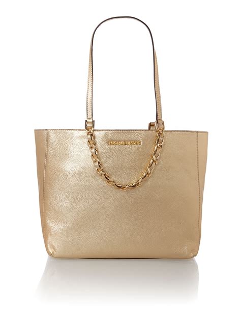 michael kors sutton clutch gold|Michael Kors gold tote handbags.